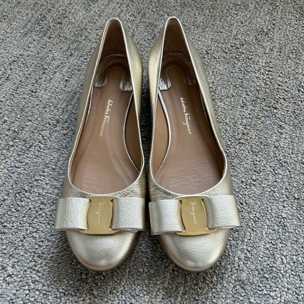 Gold Ferragamo flats like new. Size 8.5B.